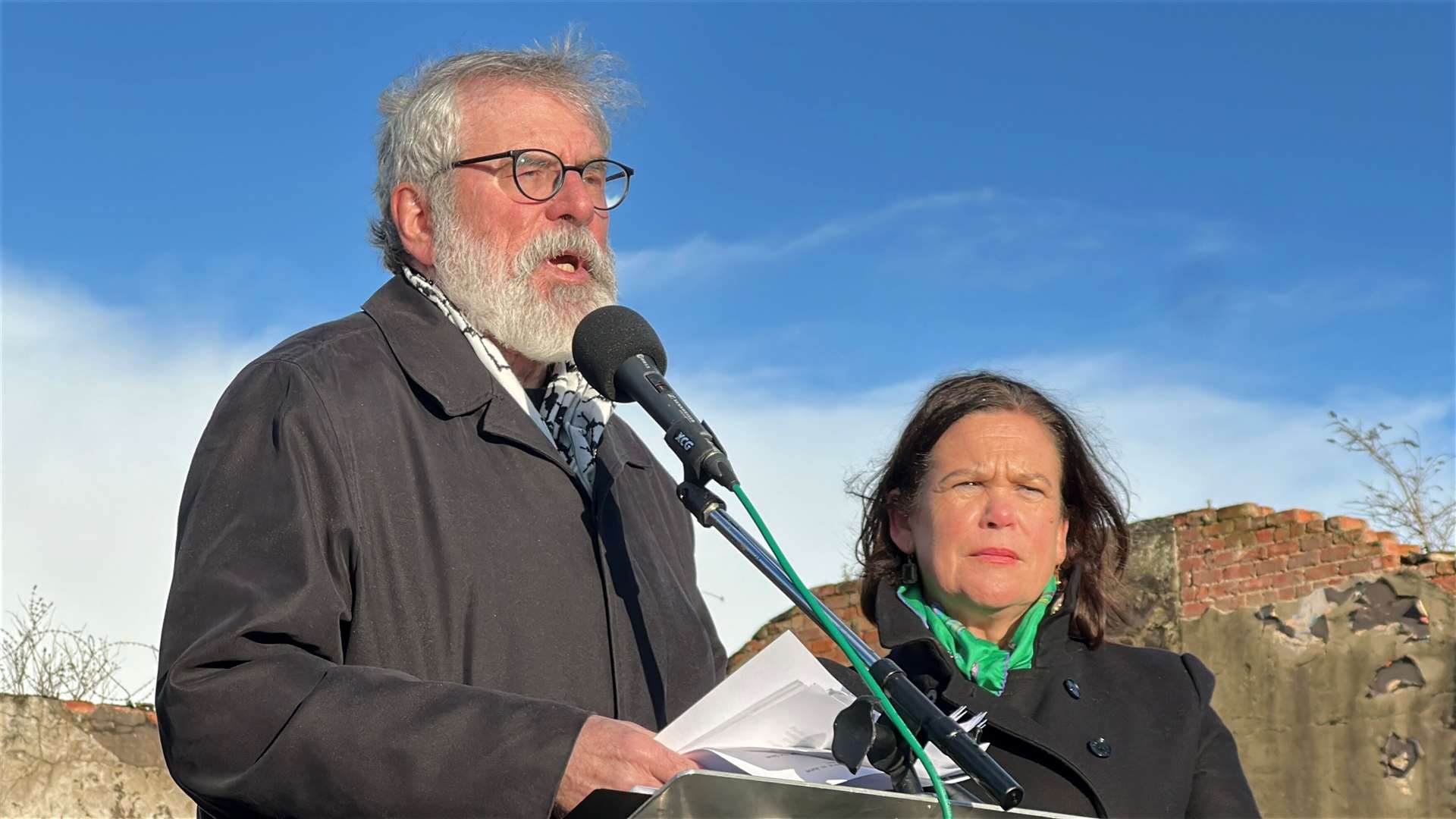 Sinn Fein leader Gerry Adams giving a graveside narration for Ted Howell at Milltown Cemetery in Belfast, alongside Sinn Fein president Mary Lou McDonald. (Liam McBurney/PA)