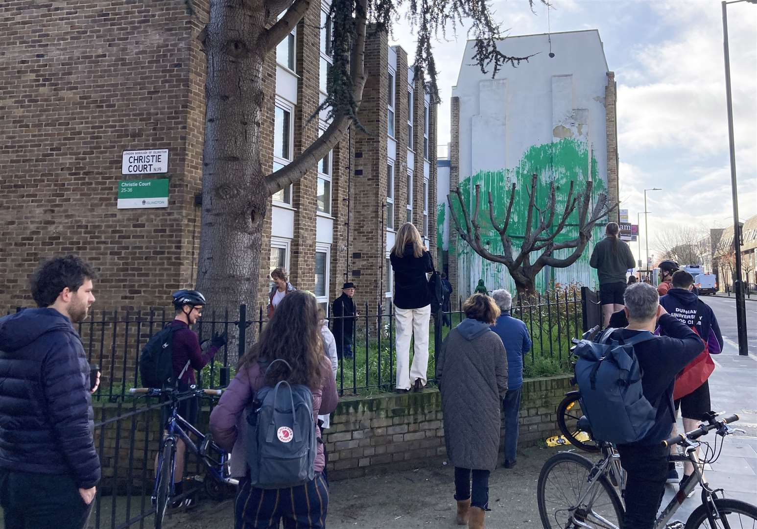 Members of the public look at a new piece of artwork (Ella Nunn/PA)