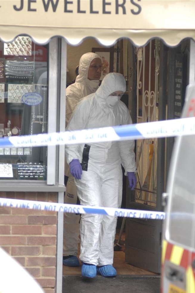 Officers scoured Battrum & Son in Sittingbourne for clues after a raid