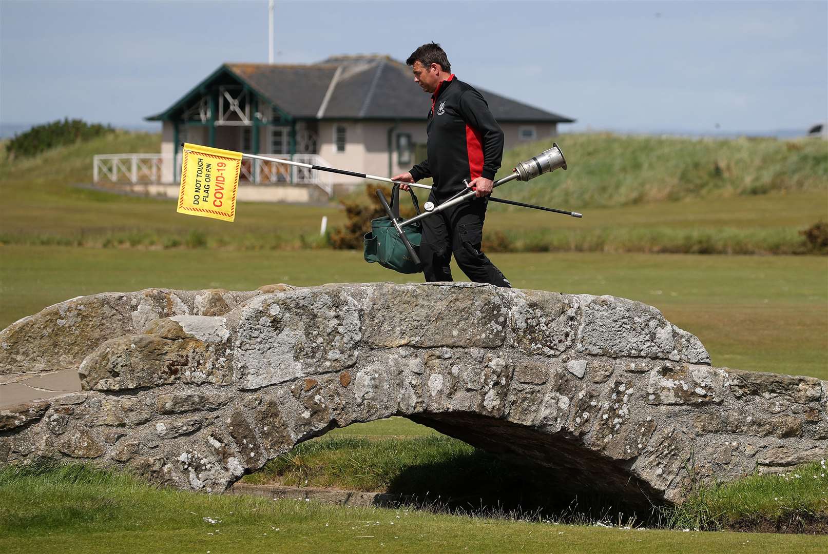 A greenkeeper preparing the Old Course at St Andrews ahead of reopening (Andrew Milligan/PA)