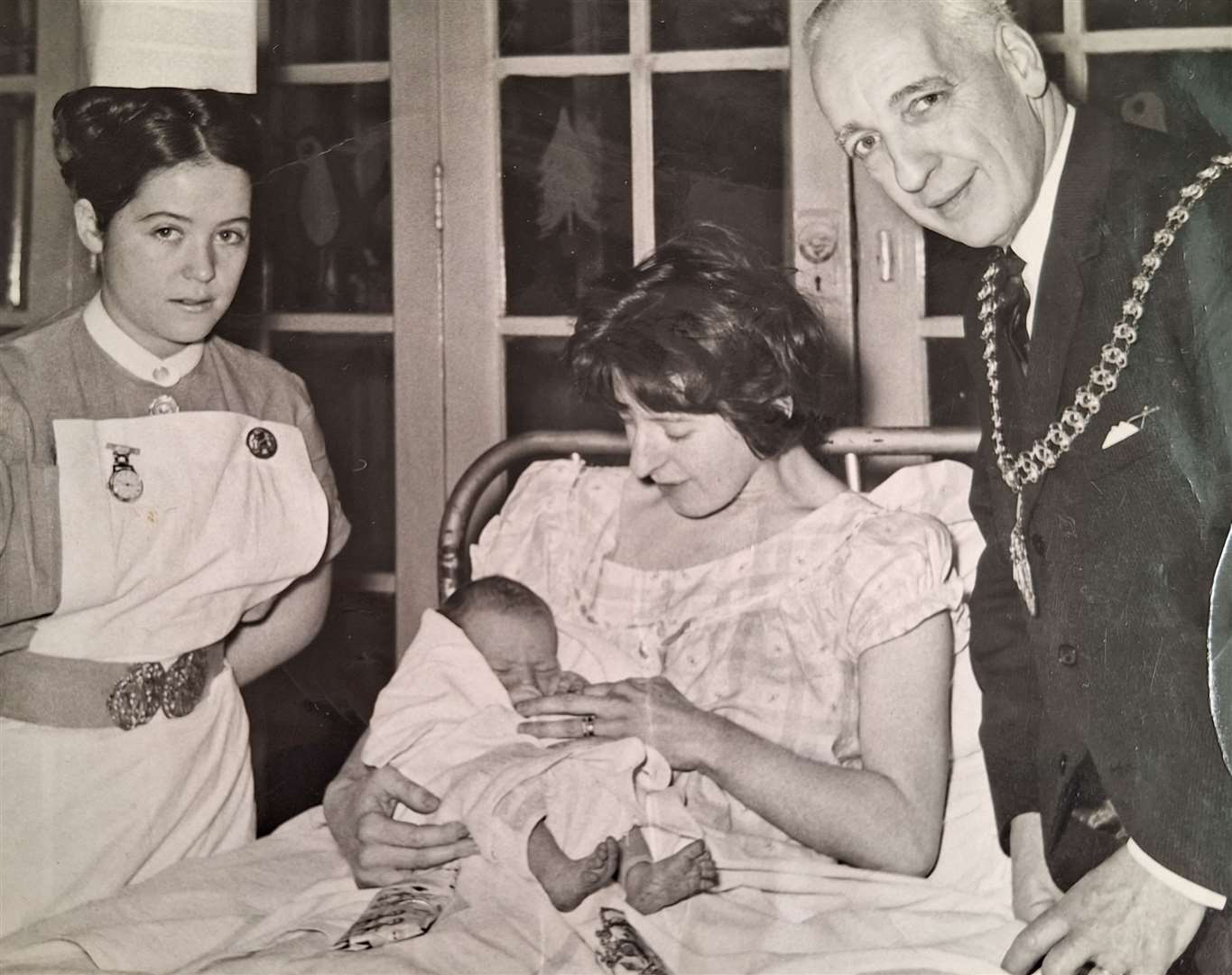 Nurse Marcella Warburton with a new mum and her Christmas Day baby and the visiting Mayor