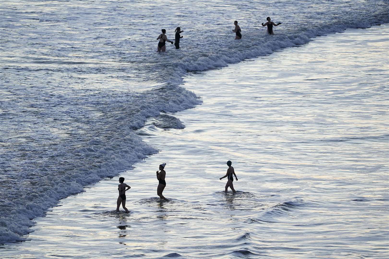 Swimmers at King Edward’s Bay in Tynemouth on New Year’s Eve (Owen Humphreys/PA)