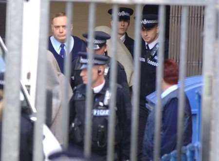 Blankets cover suspects John Fowler and Stuart Royle after the hearing at Maidstone Magistrates' Court on Thursday. Picture: GRANT FALVEY