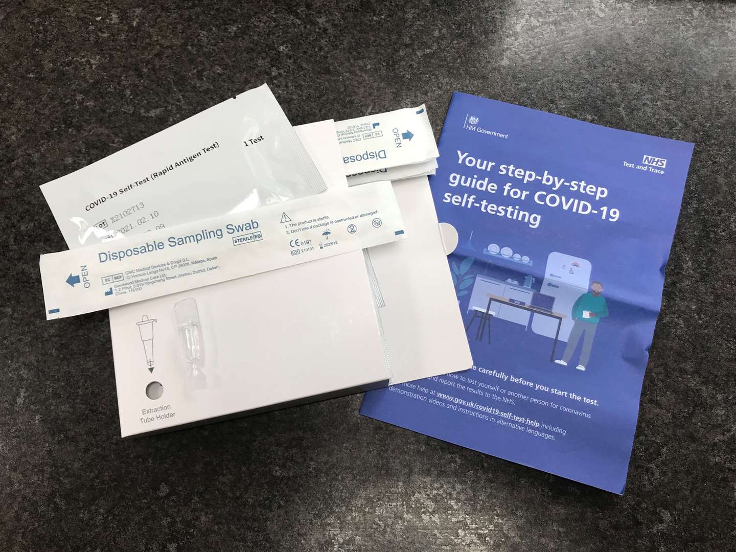 A package of seven NHS Test and Trace Covid-19 self-testing kits (Rapid Antigen Test) which has been received through the mail after ordering online for use at home (Zoe Linkson/PA)