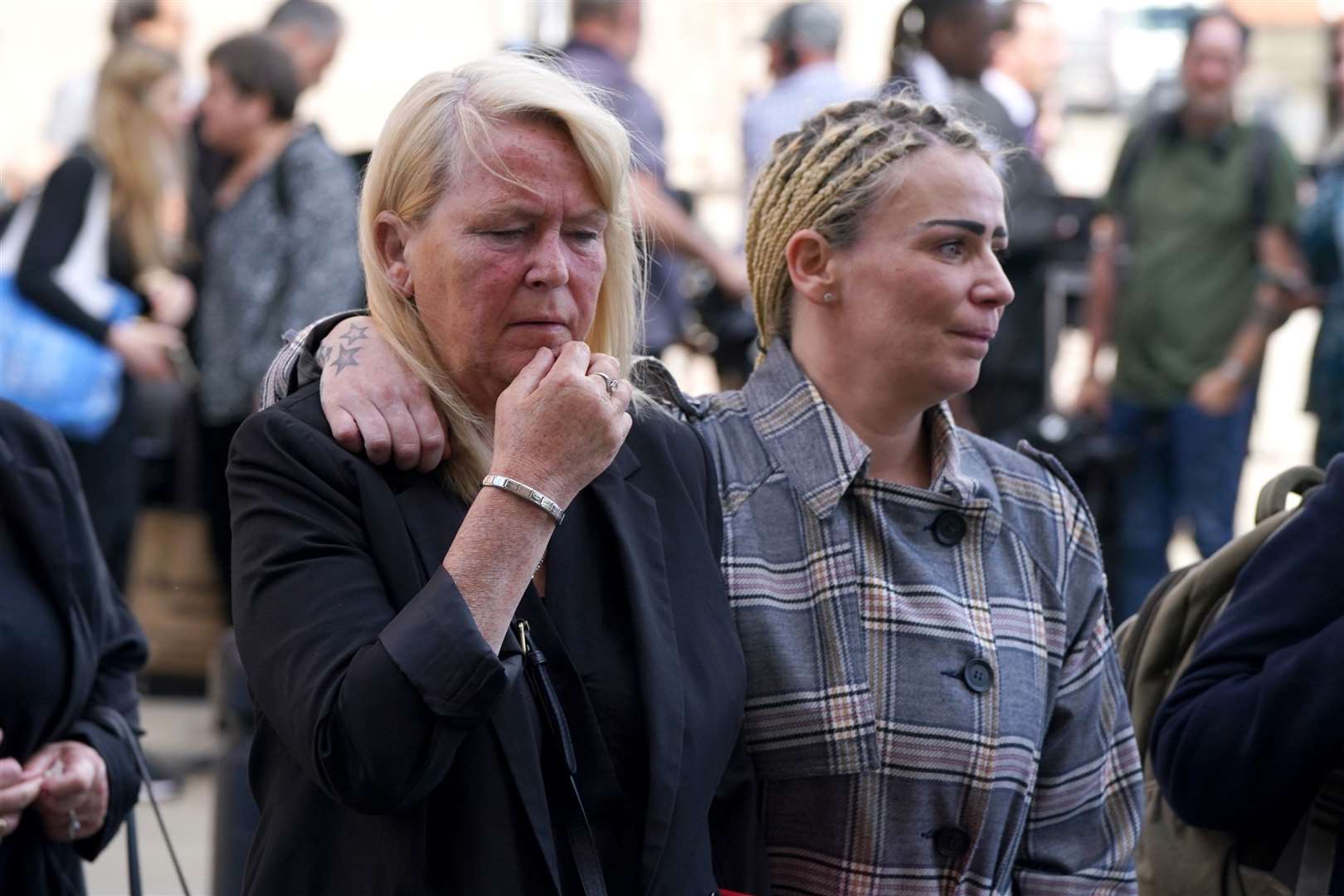 Nikki Allan’s mother Sharon Henderson, left, and Nikki’s sister, Stacey, comfort each other after seeing Nikki’s killer jailed for life (Owen Humphreys/PA)