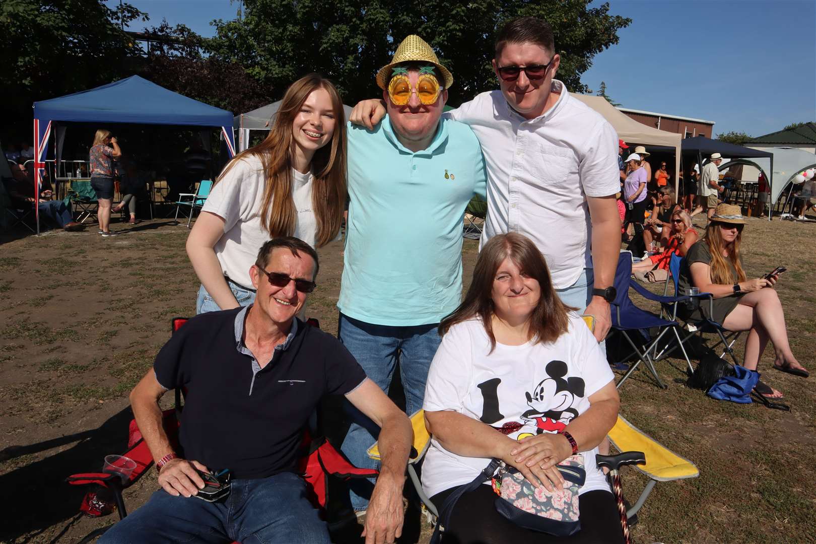 Christopher Cameron, 30, from Conyer didn't mind making a spectacle of himself at the Woodfest music festival at Woodcoombe Sports and Social Club in Murston, Sittingbourne, on Saturday. He's pictured with his family including brother Graham who was one of the acts. Picture: John Nurden (58491646)