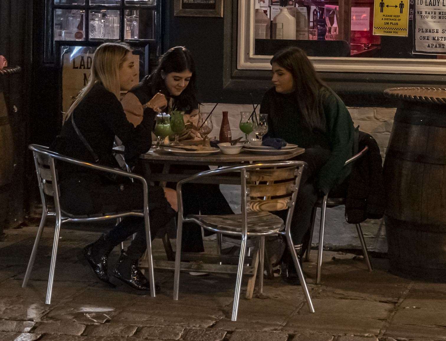 Friends outside a pub on the last night out in Canterbury before Lockdown 2. Pictures: Jo Court