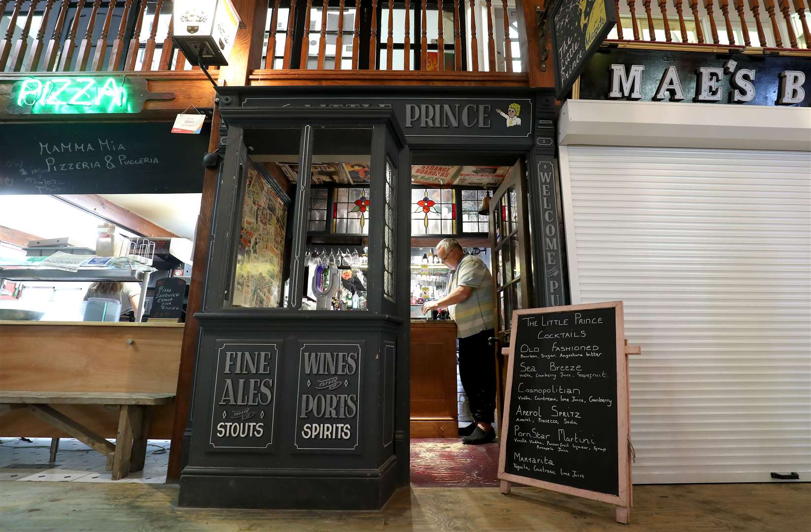 In Kent, Mark Breen, manager of The Little Prince in Margate, the smallest pub in England, makes his reopening preparations (Gareth Fuller/PA)