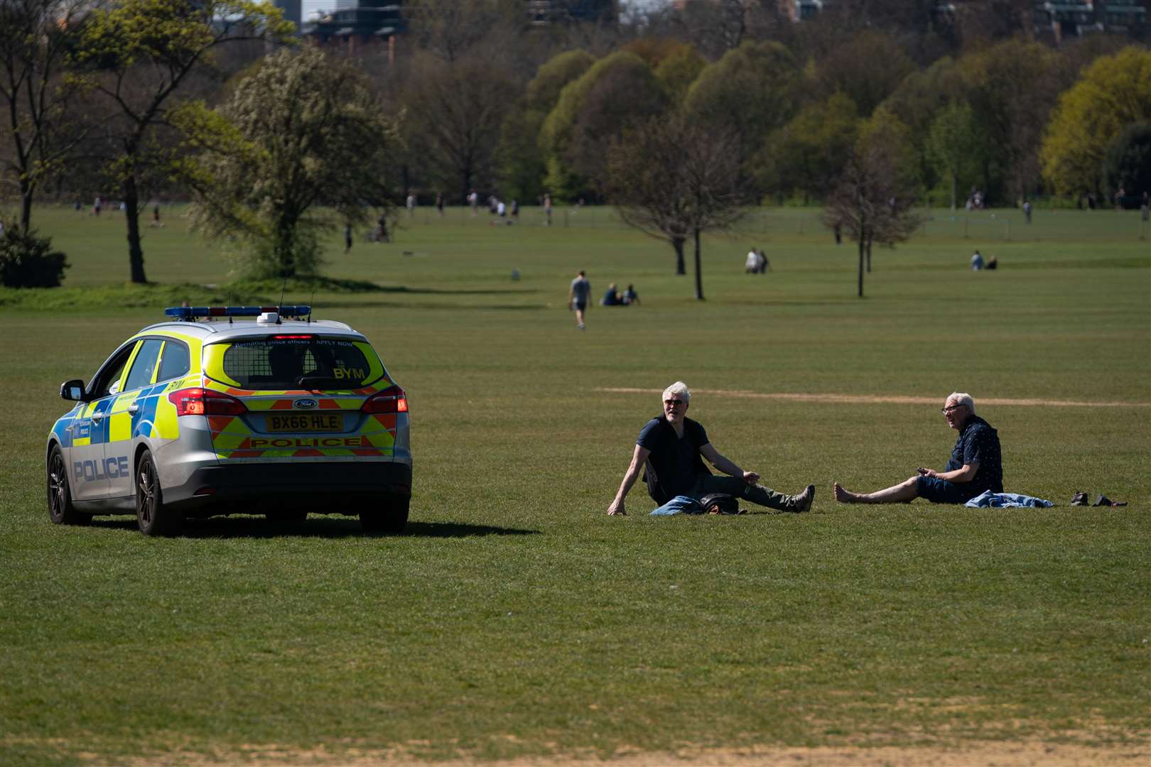 Police move on sunbathers in Regents Park (Aaron Chown/PA)