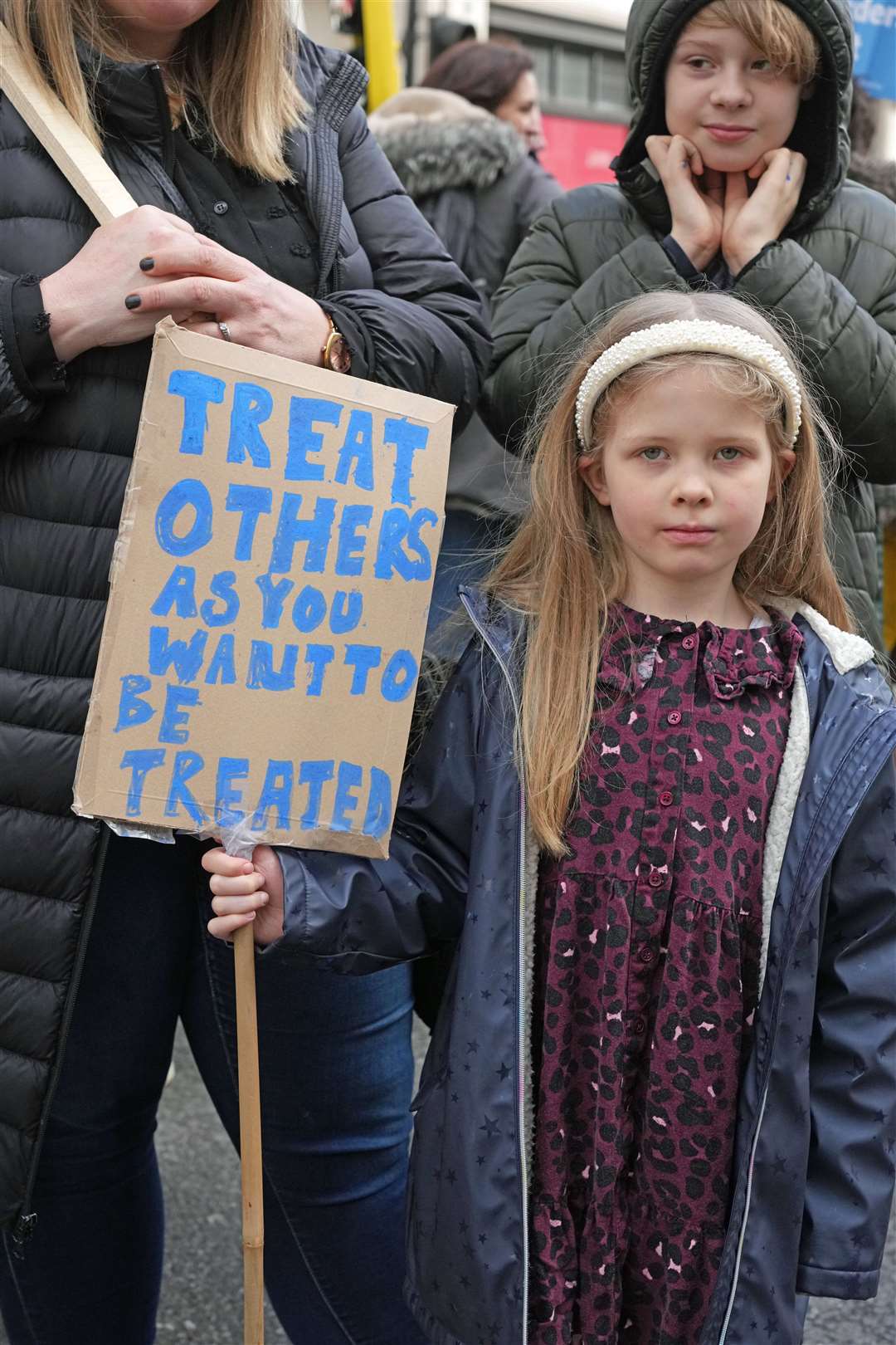 Kitty, seven, marches toward Downing Street (Jeff Moore/PA)