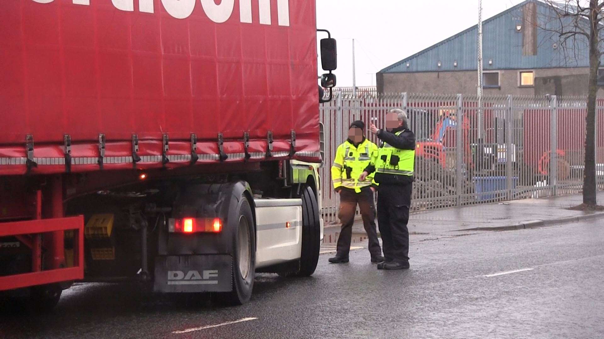 Border Force officers direct a lorry away from a port checking facility on Tuesday morning (David Young/PA)