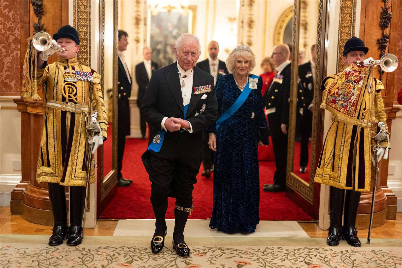 The King, in his knee breeches, and Queen at the Diplomatic Corps reception (Aaron Chown/PA)