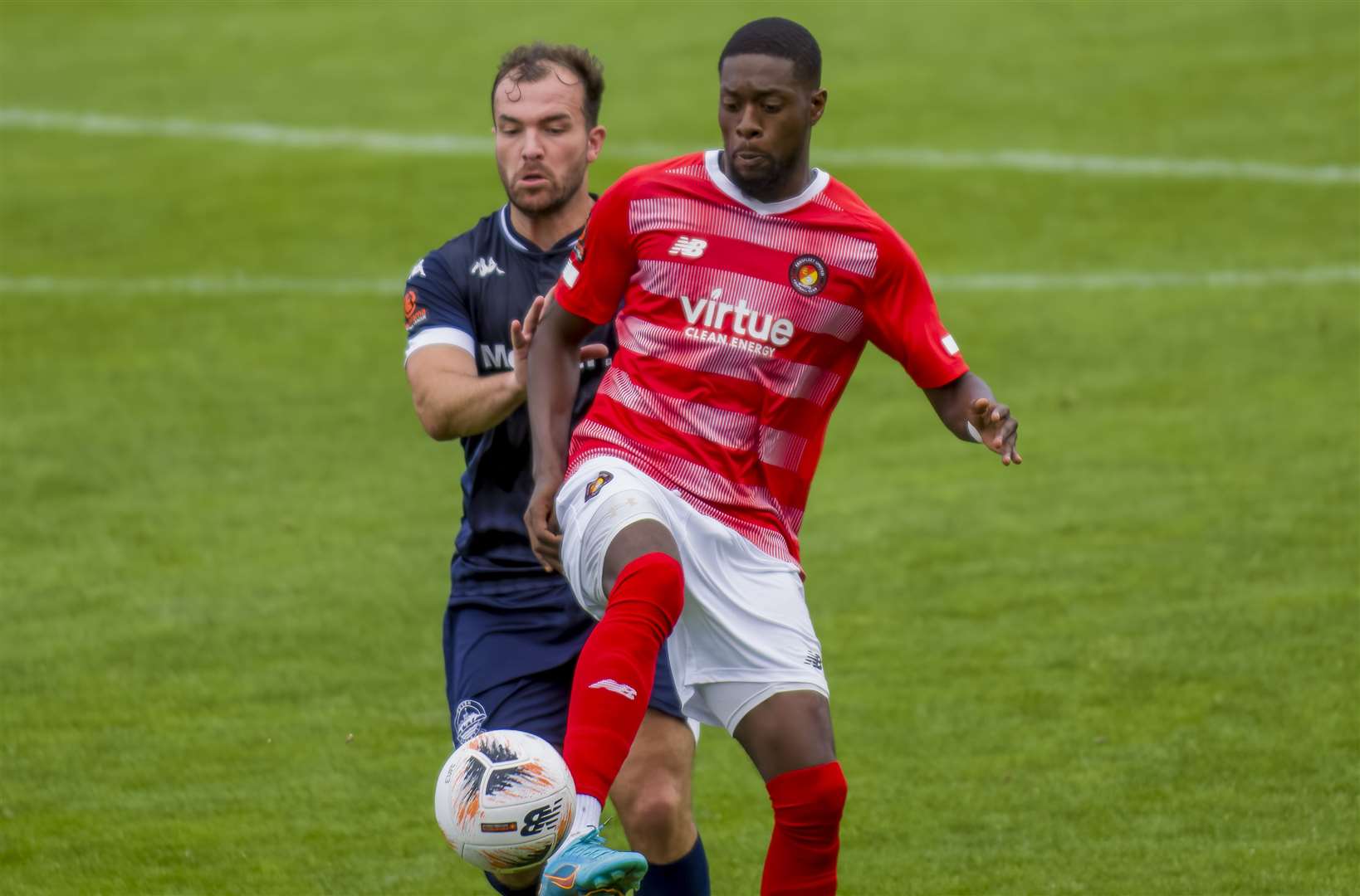 New Dover boss Mitch Brundle this season up against Ebbsfleet forward Rakish Bingham. Picture: Ed Miller/EUFC