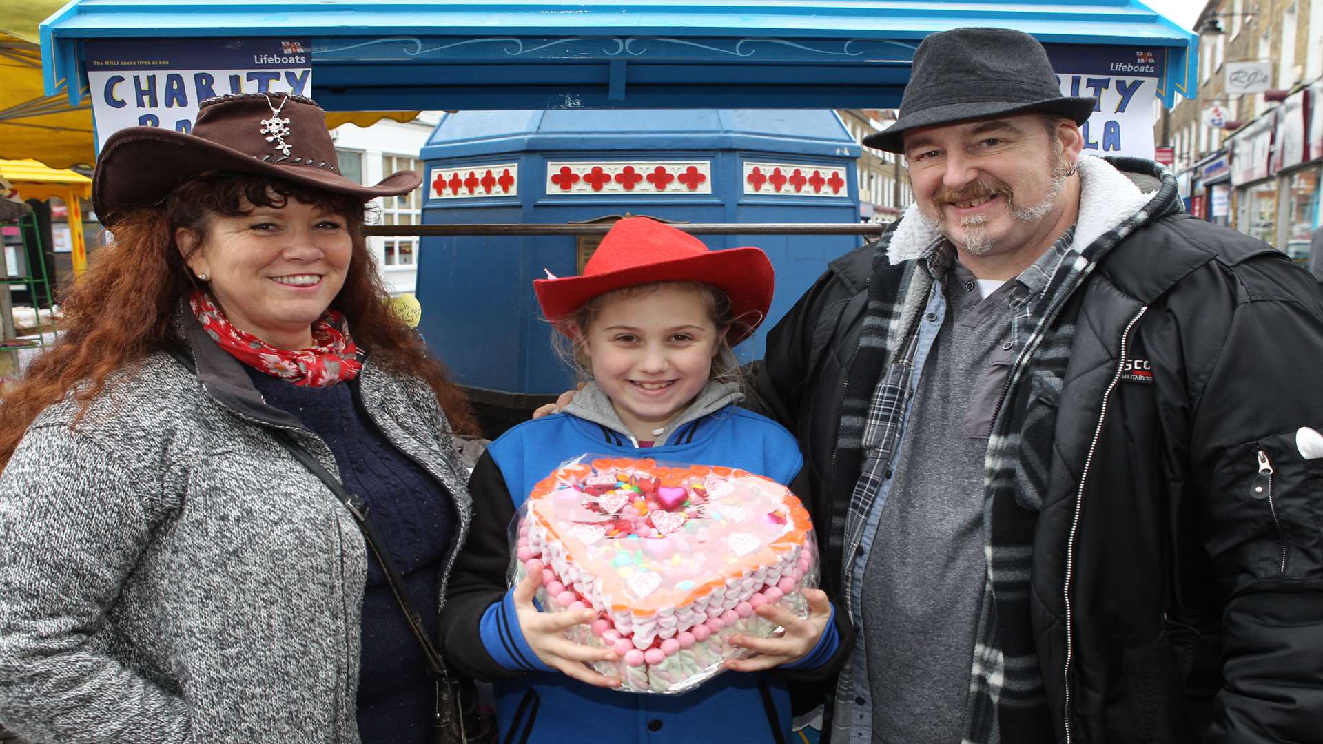 Jackie Hopwood, Kaci, and Kevin running a stall to raise money for the RNLI