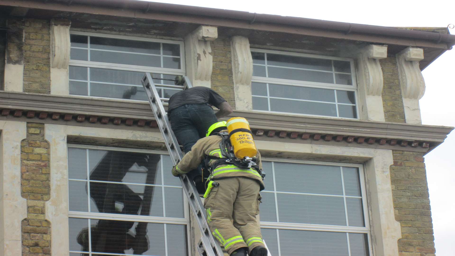 Craig makes his way down the ladder to safety