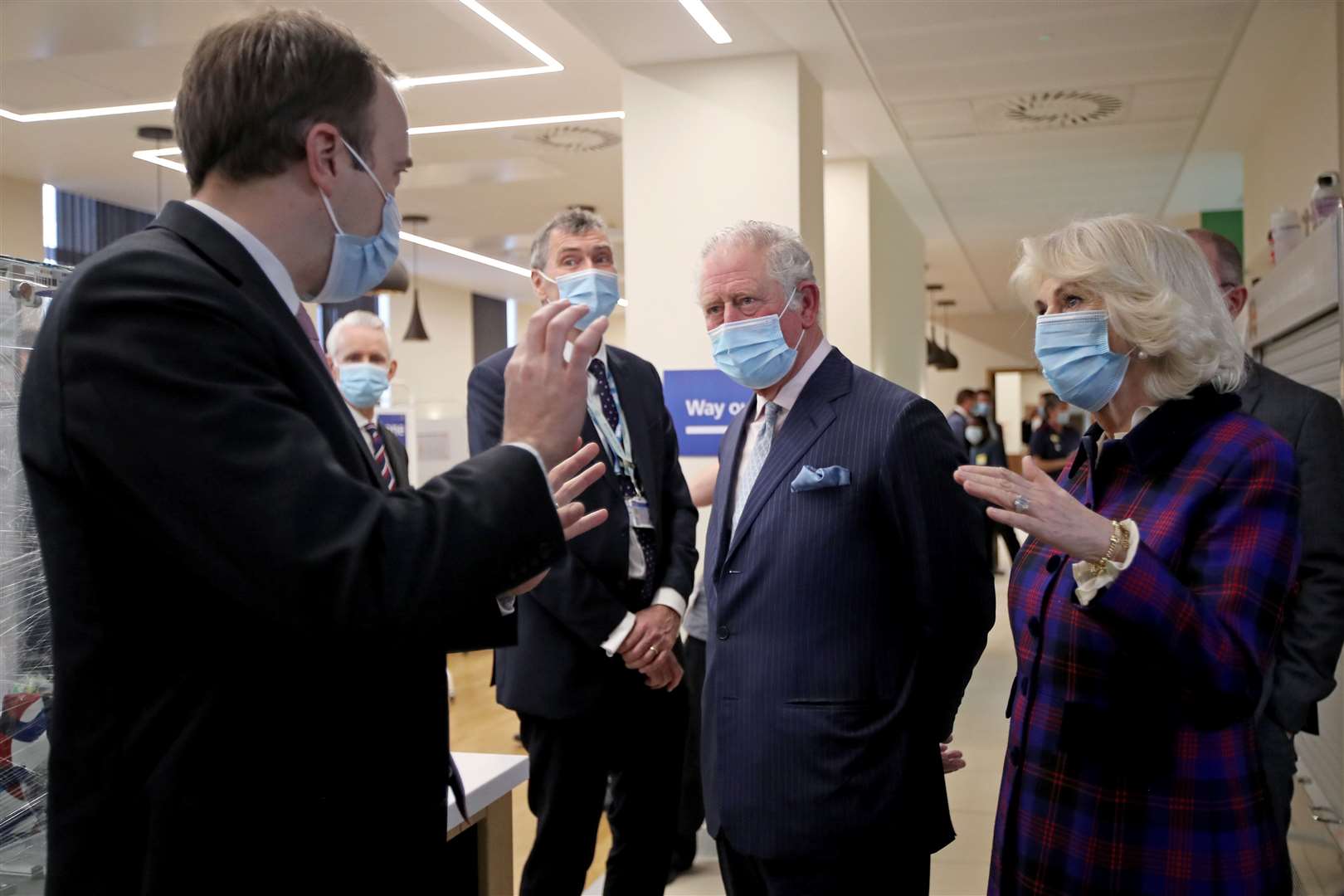 The Prince of Wales and Duchess of Cornwall talk with Health Secretary Matt Hancock (Molly Darlington/PA)