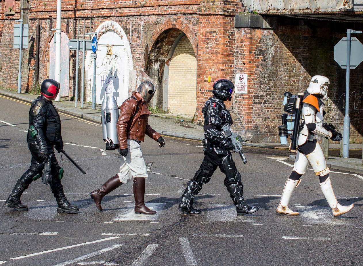 Characters re-enacting the famous Beatles album cover