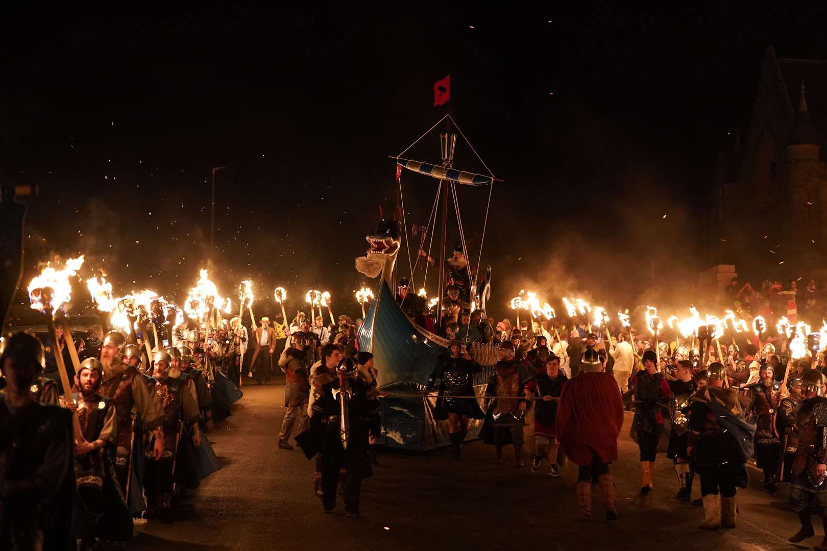 The Jarl Squad set light to a galley in Lerwick on the Shetland Isles during the Up Helly Aa fire festival at the end of January (Andrew Milligan/PA)