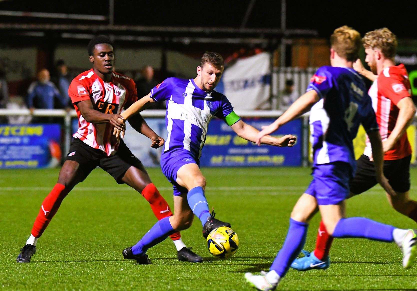 Herne Bay skipper Kane Rowland is closed down by Sheppey defender Lekan Majoyegbe. Picture: Marc Richards