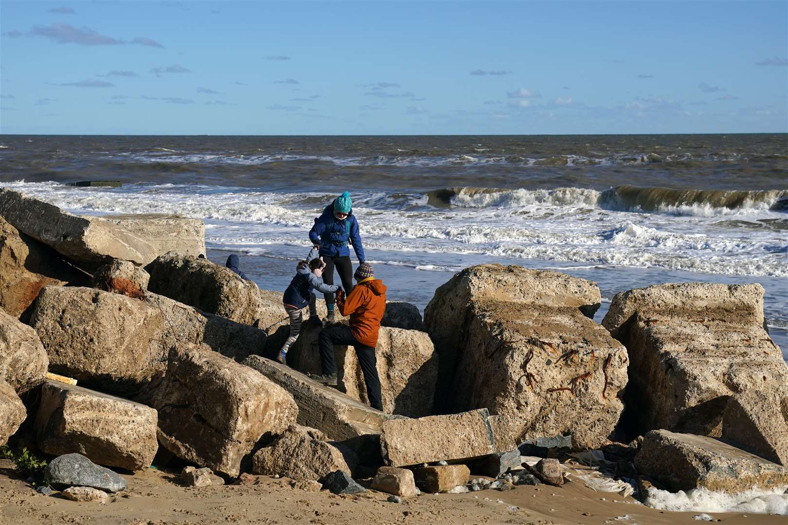 People climb off the beach at Hemsby (Joe Giddens/PA Wire)