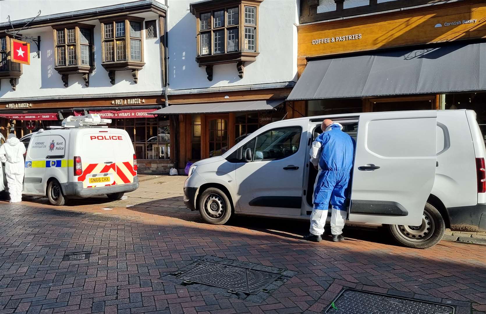 Forensics working in Canterbury High Street after a suspected murder probe was launched