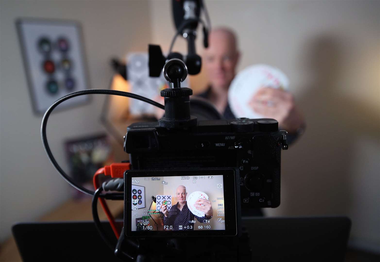 Magician Darren Delaney films his show using Zoom (Yui Mok/PA)