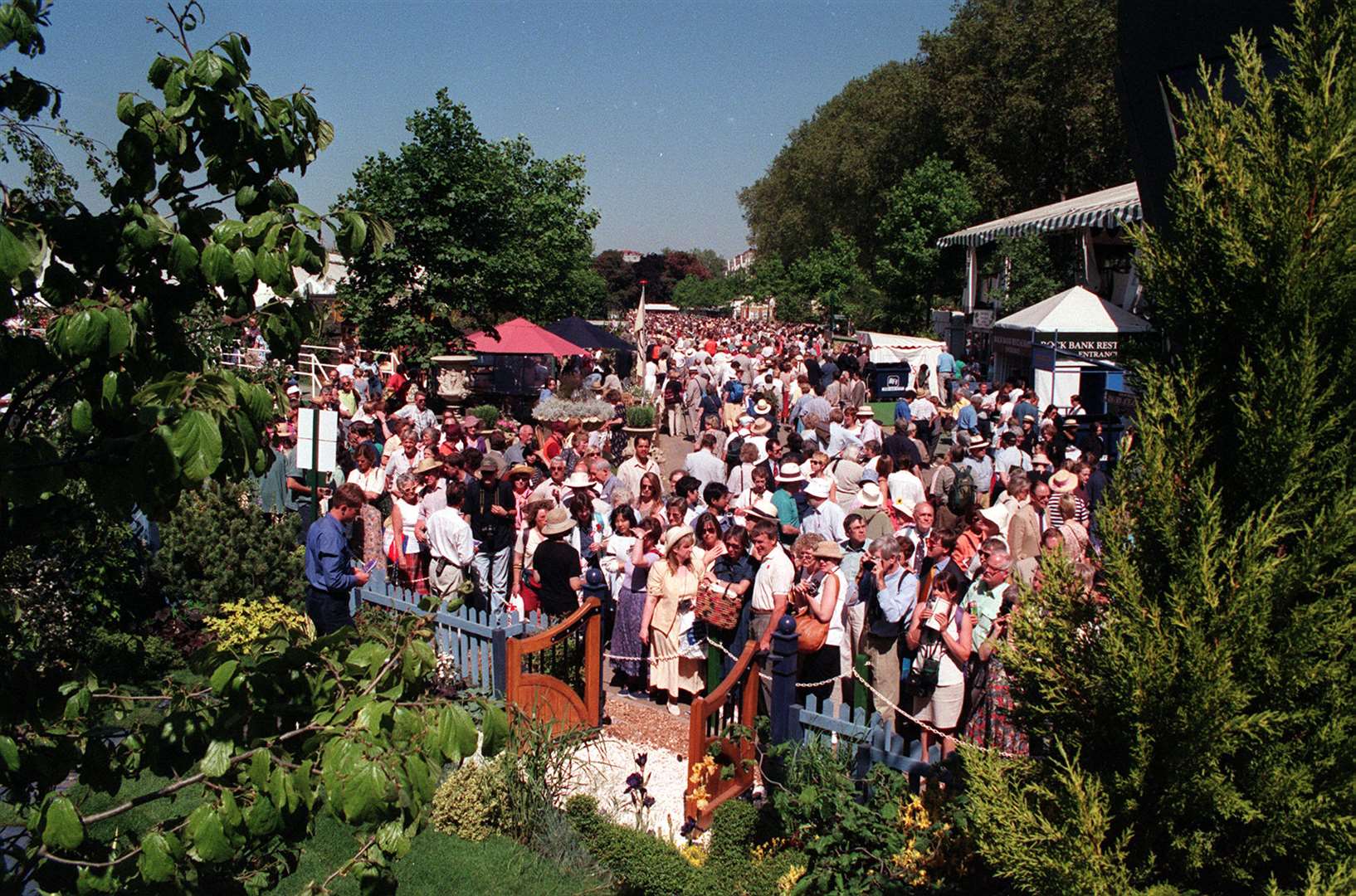 Social distancing has never been easy at the Chelsea Flower Show site– here crowds gather in 1998 (PA)