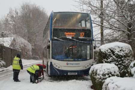 A school bus gets stuck on Derringstone Hill in Barham on Tuesday morning.