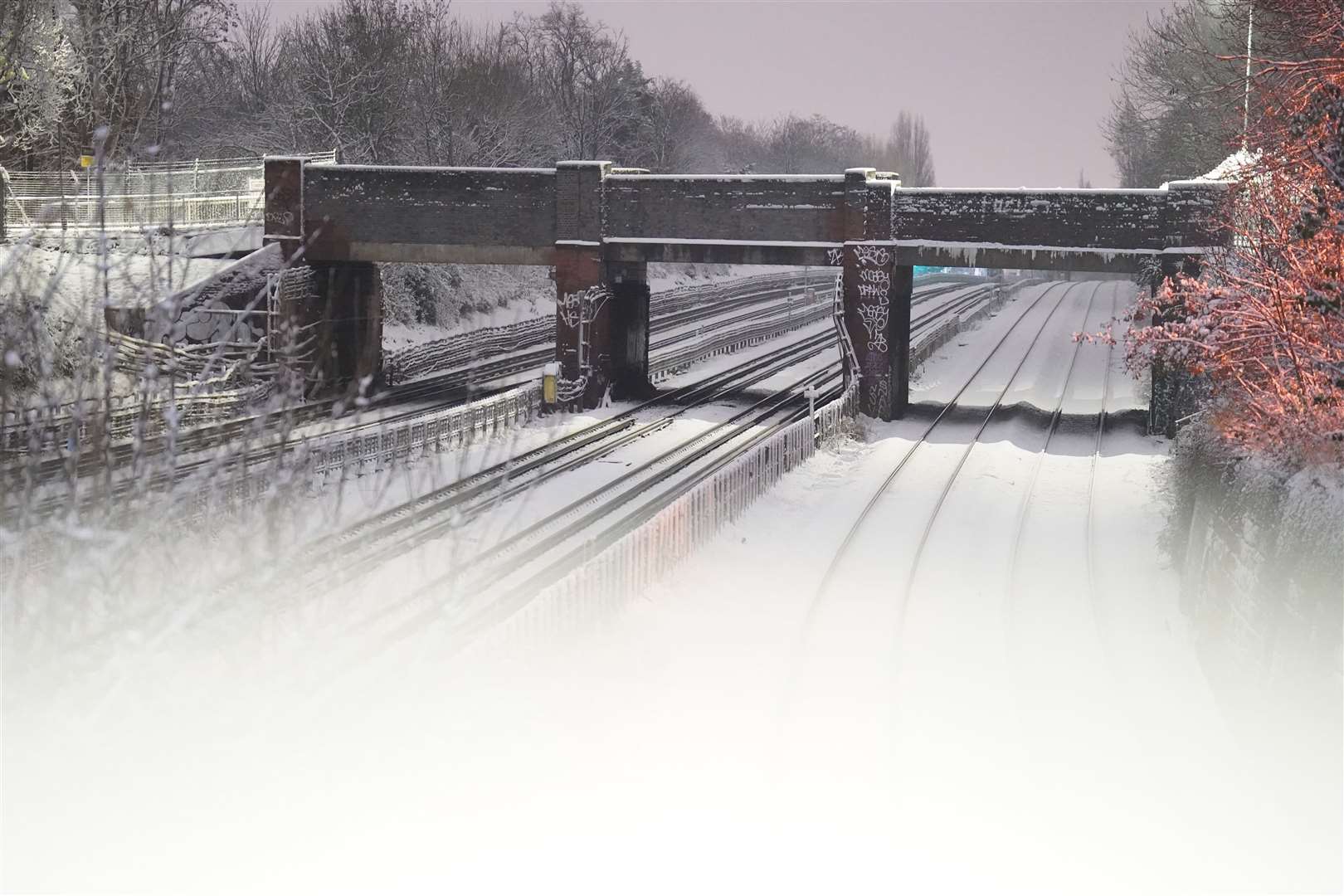 Snow covers the rail tracks for the London Underground lines in Willesden Green, north-west London (James Manning/PA)