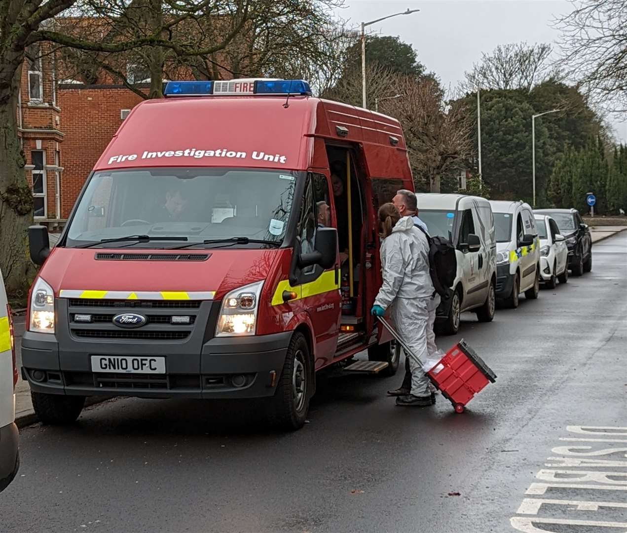 Forensic teams and fire crews at the scene yesterday