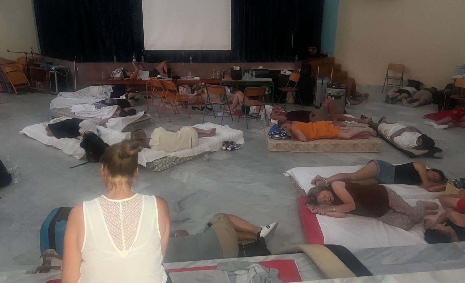 Emily and Alan, as well as some of their friends, had to sleep on the floor of a local school. Picture: Emily Martin