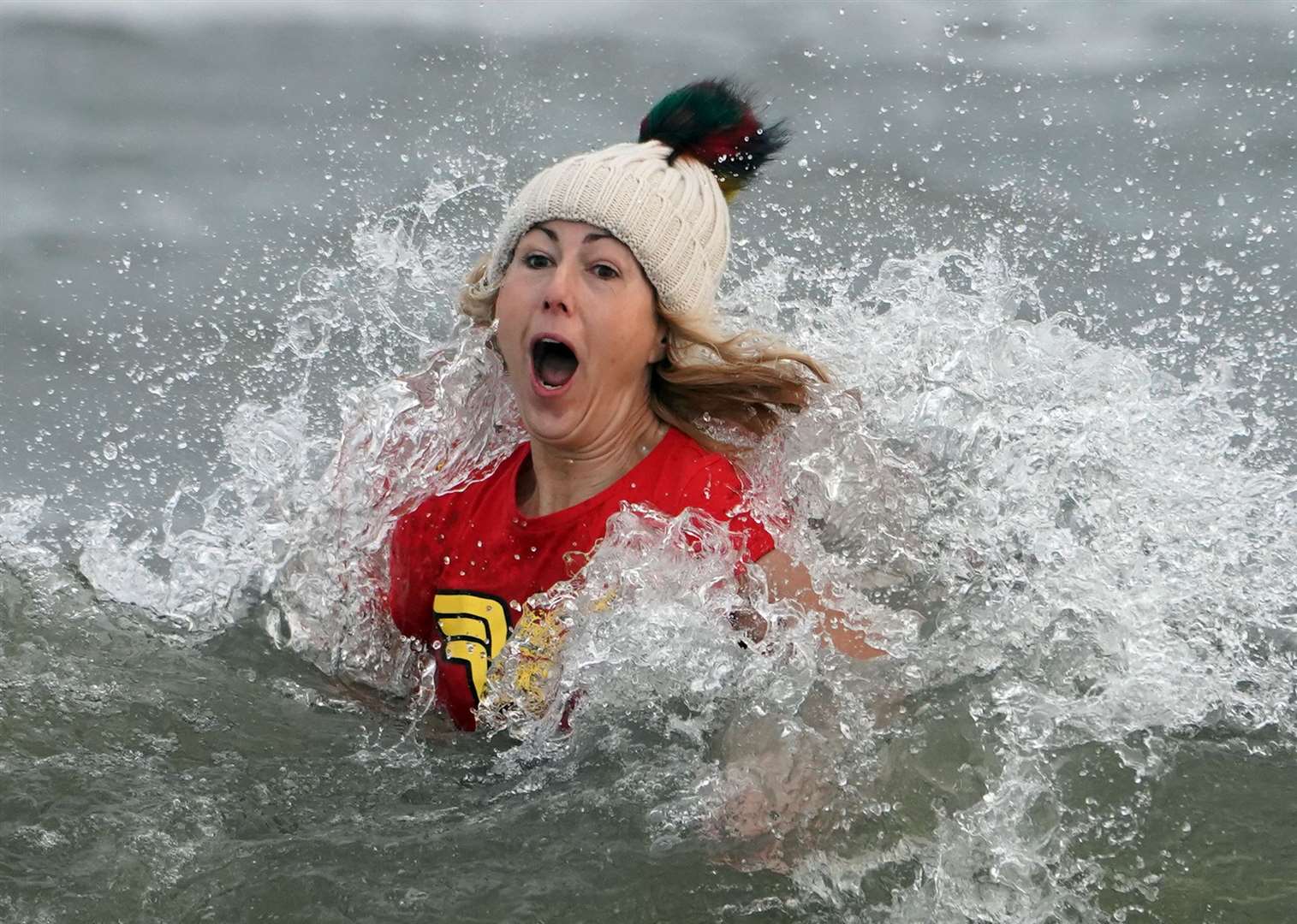 Emma Booth, 41, from Stockton, feels the chill at Whitley Bay (Owen Humphreys/PA)