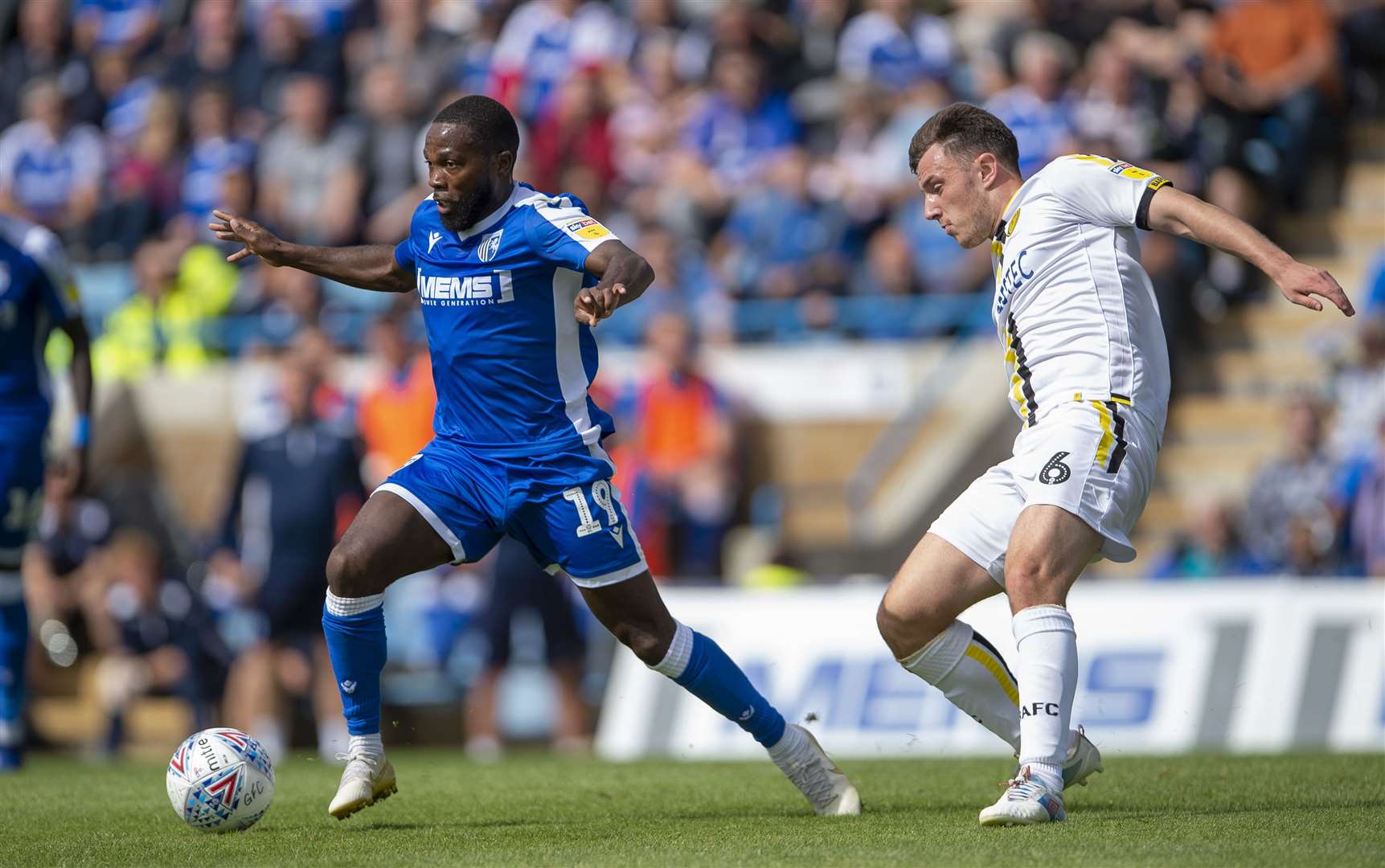 Gillingham's Mark Marshall gets away from Kieran Wallace Picture: Ady Kerry