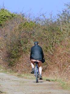 Graham Long’s photo of the man he caught riding his bicycle half naked