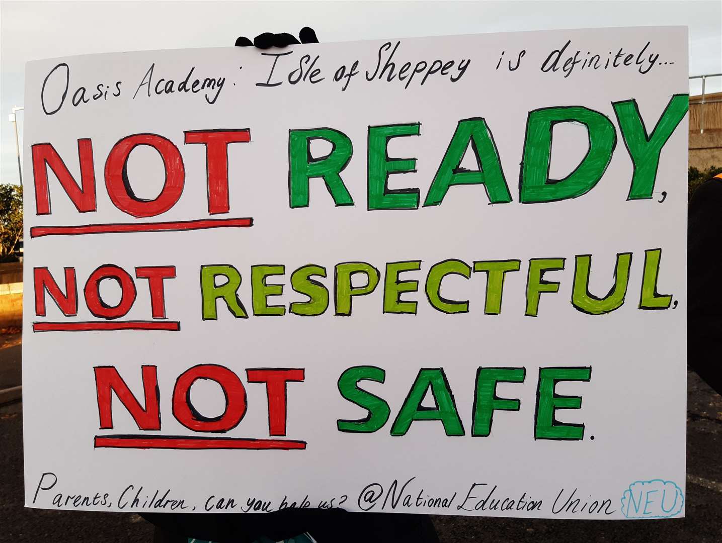 A sign being waved by one of the protesters at the Oasis Academy teacher strikes