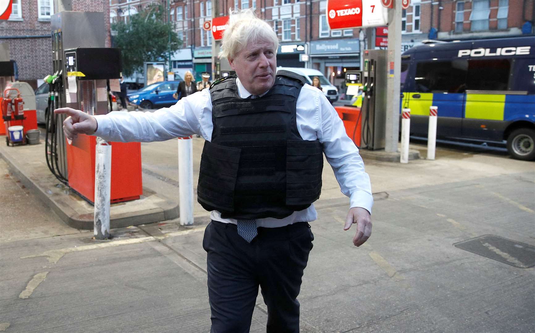 Mr Johnson leaves the area after viewing a drugs-related raid by Metropolitan Police officers in West Norwood, London (Peter Nicholls/PA)