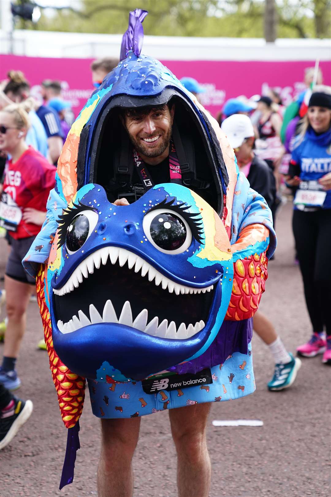 Joel Dommett ran for Shooting Star Children’s Hospices dressed in the Piranha costume from The Masked Singer (John Walton/PA)