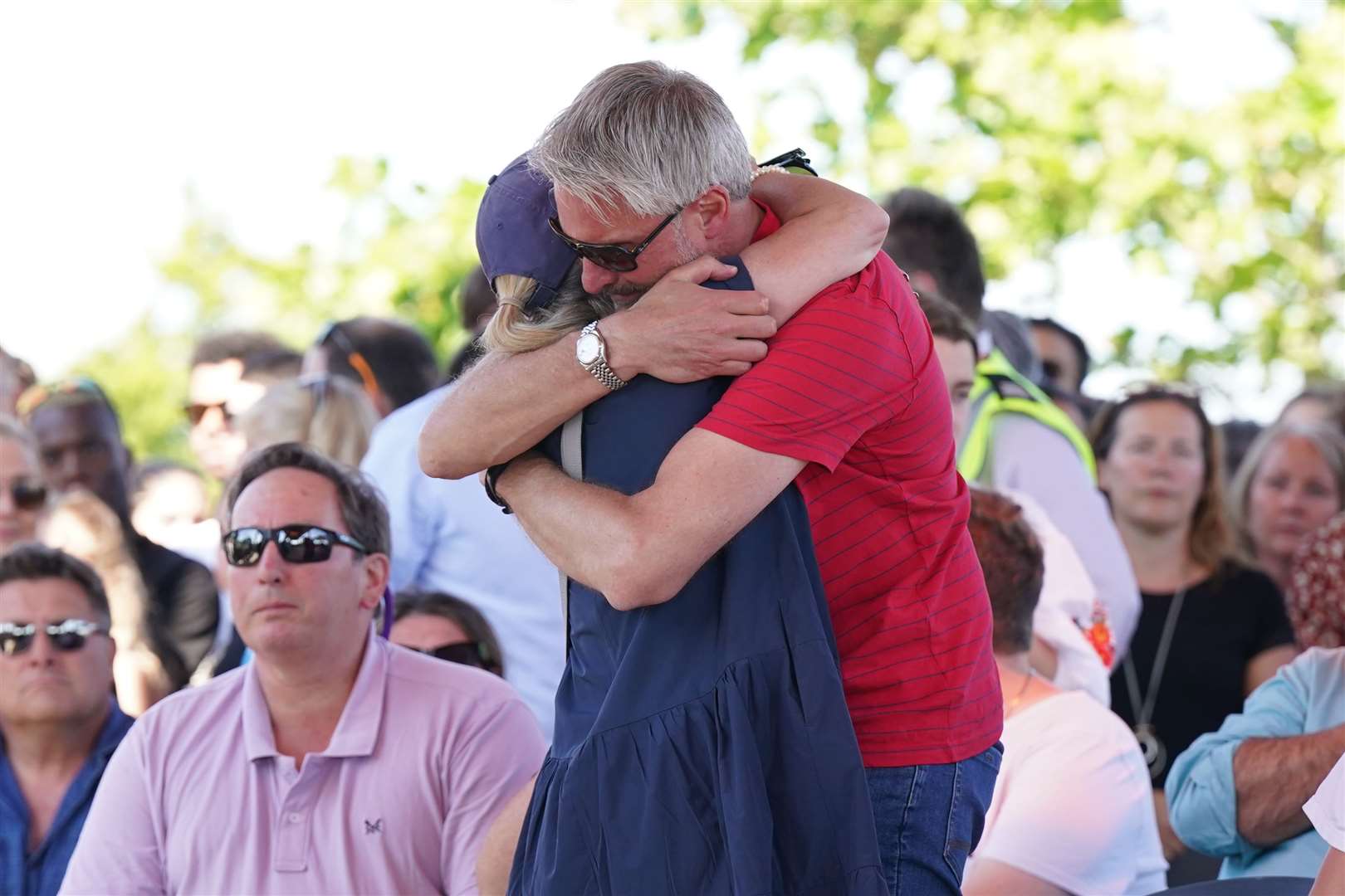 Barnaby Webber’s father David embraced Grace O’Malley Kumar’s mother, Sinead, at a vigil for their children at the University of Nottingham (Jacob King/PA)