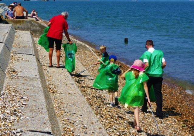 Litter pickers searching for rubbish at Sheerness beach. Stock image. Picture: Lee Pearce