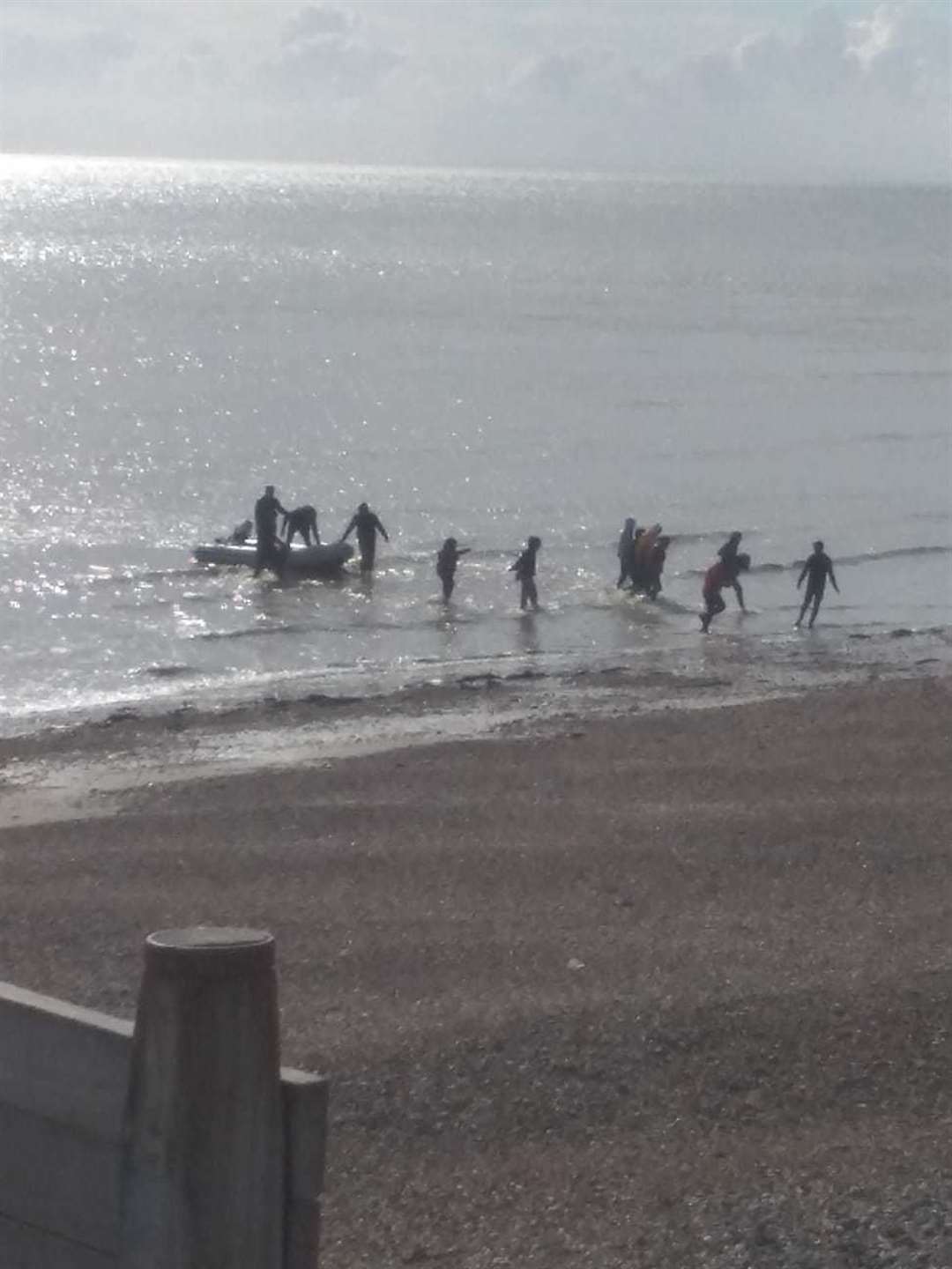 Between 14-16 migrants came ashore at Kingsdown and fled, leaving their small boat in the water. Picture Kristian Thrale