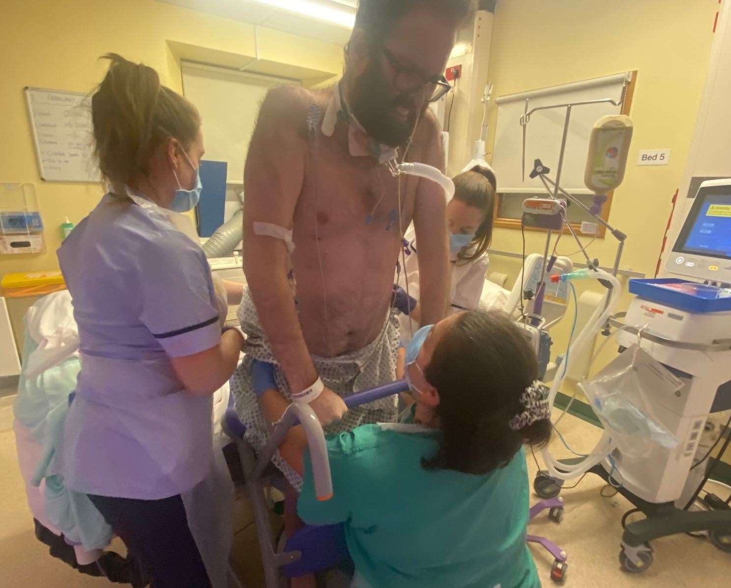 Olly Toole practising standing while in hospital. Picture: EKHUFT