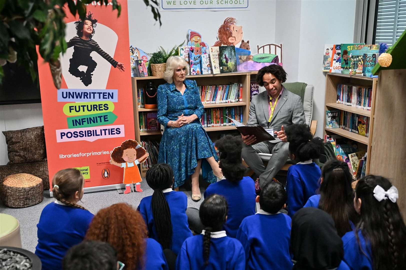 The Queen with Children’s Laureate and poet Joseph Coelho who has been made an OBE (Justin Tallis/PA)