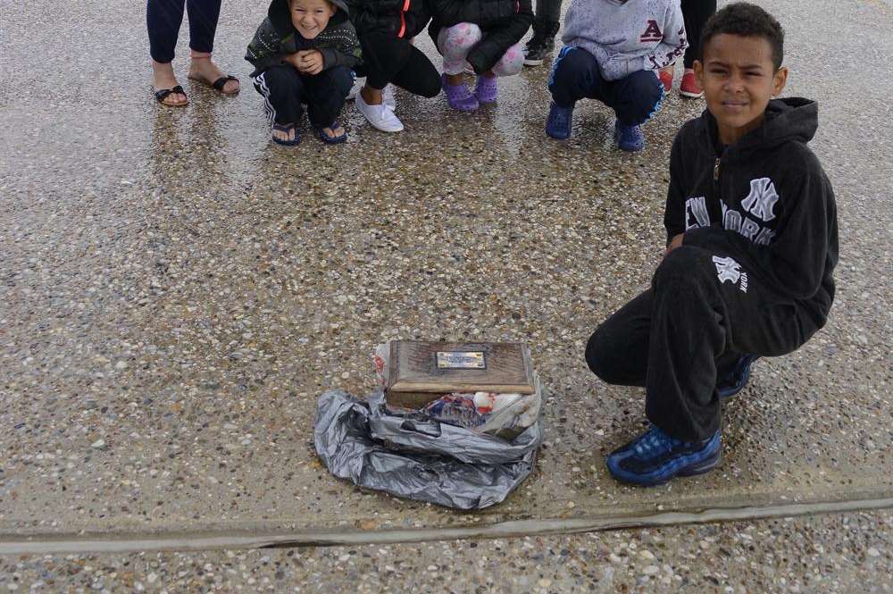 Mason Brooks with family and friends and the ashes casket on Dymchurch seafront.