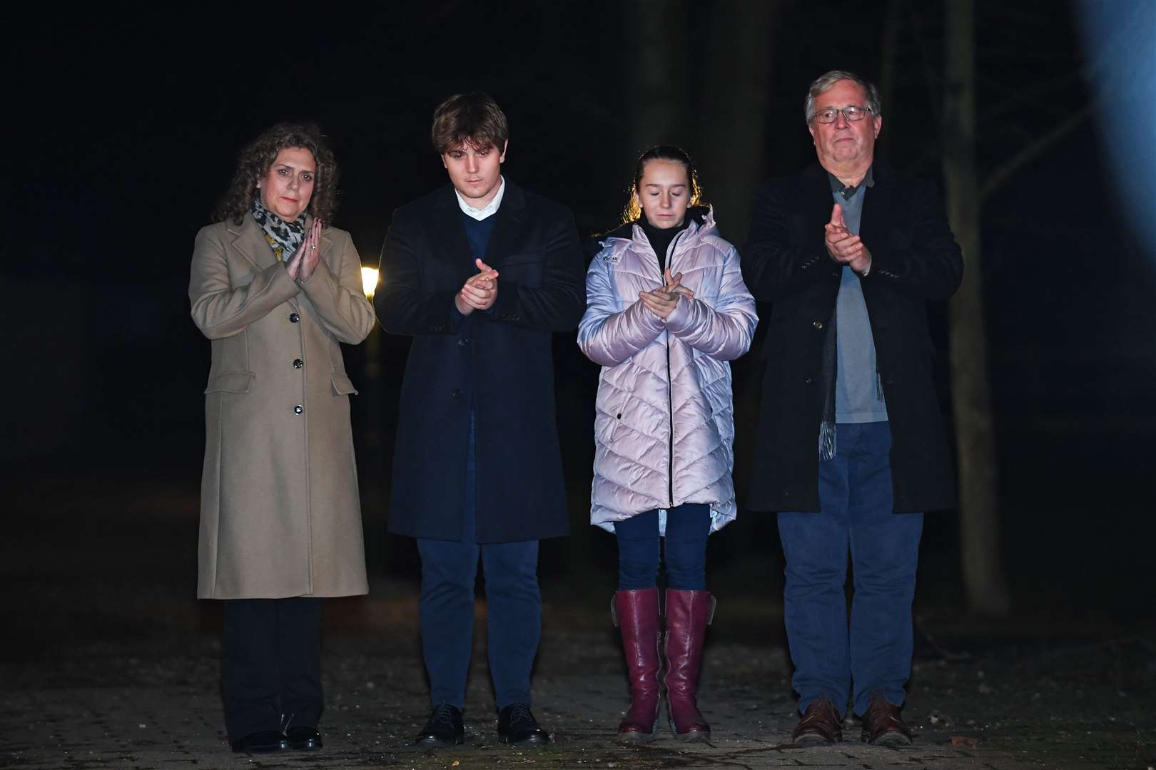 Captain Sir Tom Moore’s daughter Hannah Ingram-Moore, grandson Benji, granddaughter Georgia and son-in-law Colin Ingram outside his the home in Marston Moretaine, Bedfordshire (Joe Giddens/PA)