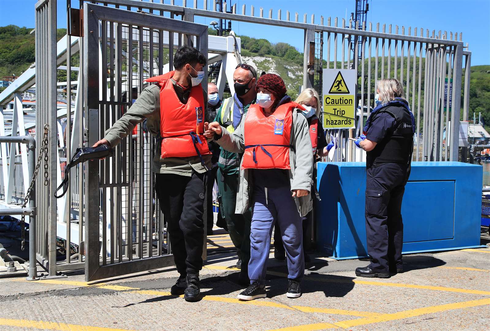 A group of people are brought in to Dover (Gareth Fuller/PA)