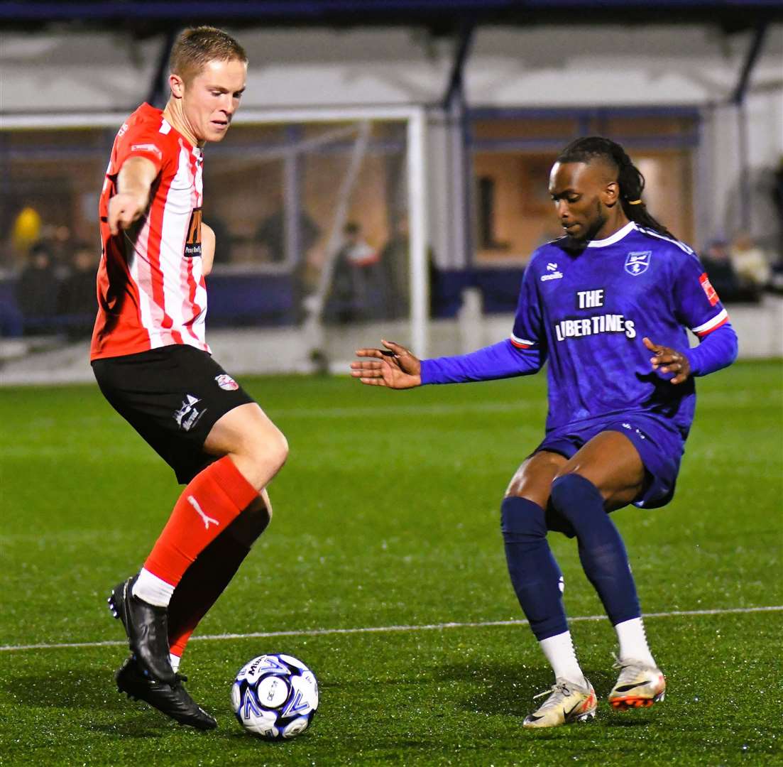 Sheppey's Joe Tyrie, on dual registration from Tonbridge, attempts to get past Margate's Ibrahim Olutade as Gate suffered a 4-2 Velocity Cup loss last Tuesday. Picture: Marc Richards