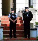 Police officers outside the property. Picture: Nick Evans