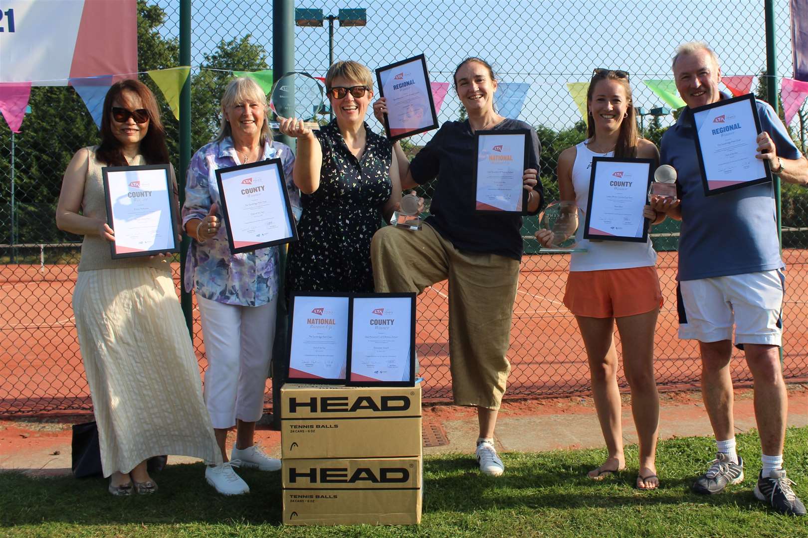 Renee Raducanu, Emma's mum, far left, collects her Kent LTA player of-the-year award. She is pictured alongside Kent LTA deputy president Sandi Procter, Karen Hodgson (Deal Parochial Primary School), Justine Brown (head teacher Deal Parochial Church of England Primary School), Jacqueline Darby (vice-captain Kent LTA ladies' team) and Mark Bradon (Sundridge Park)