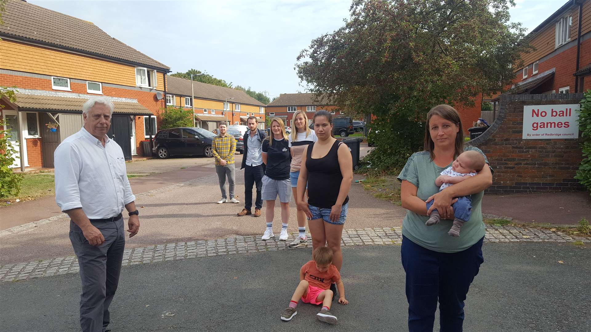 Cllr Dave Wilson (left) with families facing eviction