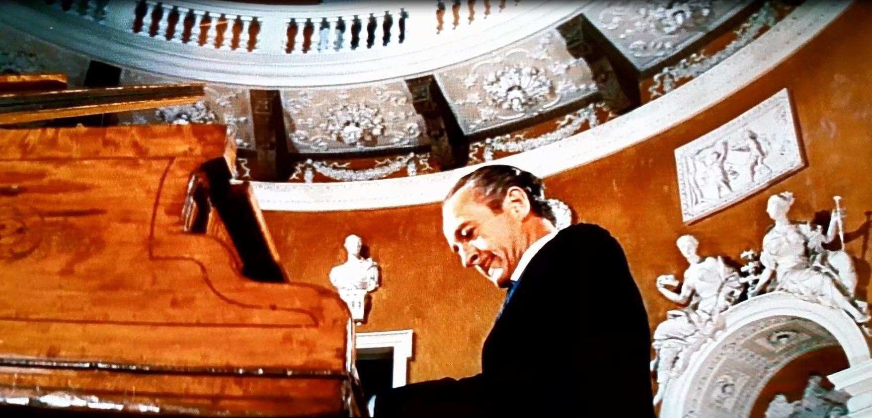 Sir James Bond (David Niven) playing Debussy inside the dome of Mereworth Castle